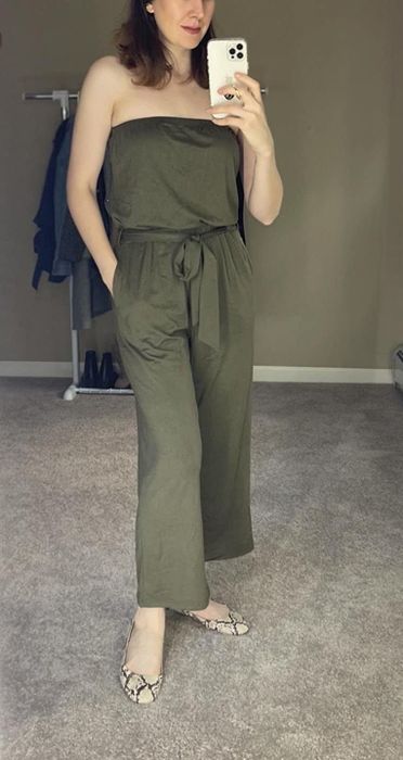 front view of another reviewer wearing the army green version of the jumpsuit