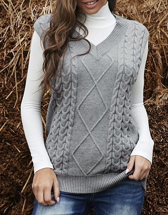 A model wearing the grey sweater vest.