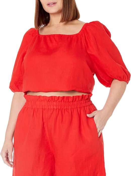 a model showcasing the cropped bubble top in red