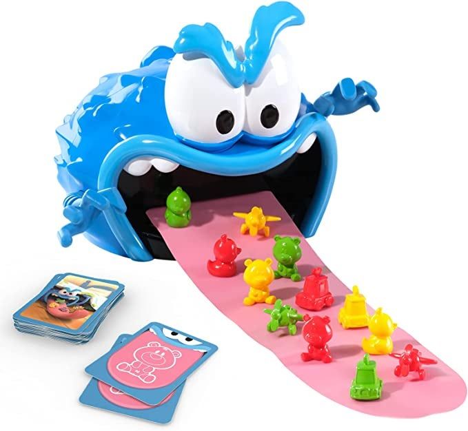 A close-up of the monster, its tongue loaded with toys, and the playing cards scattered nearby