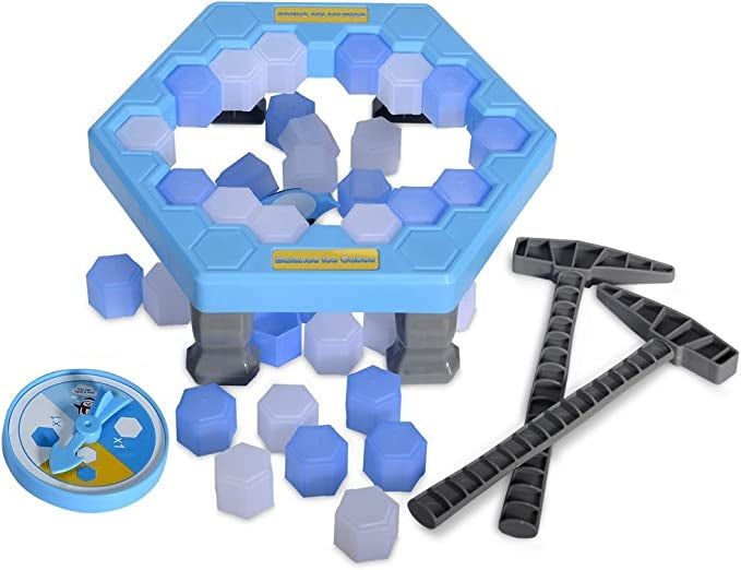 A close-up of the toy along with its accessories: a spinner, ice blocks, and two ice picks