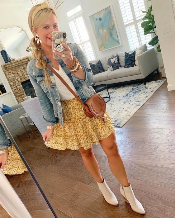 A reviewer wearing the yellow version of the skirt