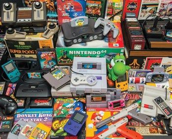 an image of a puzzle depicting classic video games and consoles from the past