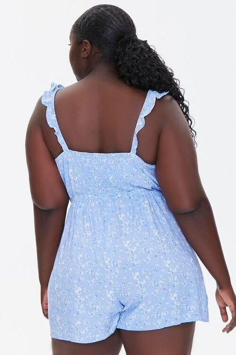 a rear view of the same model highlighting the shirred detailing at the top of the romper
