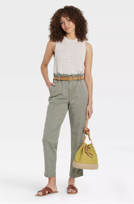 Model wearing olive gray high-waist pants, a stylish and comfortable choice for any occasion.