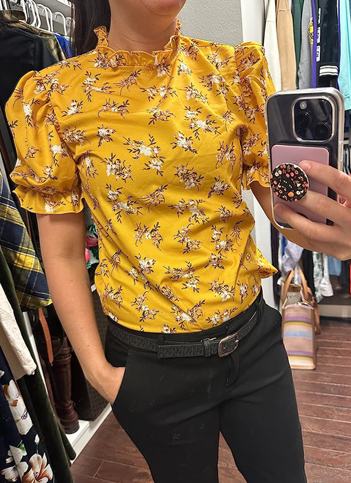 a reviewer wearing the yellow shirt with a white floral pattern