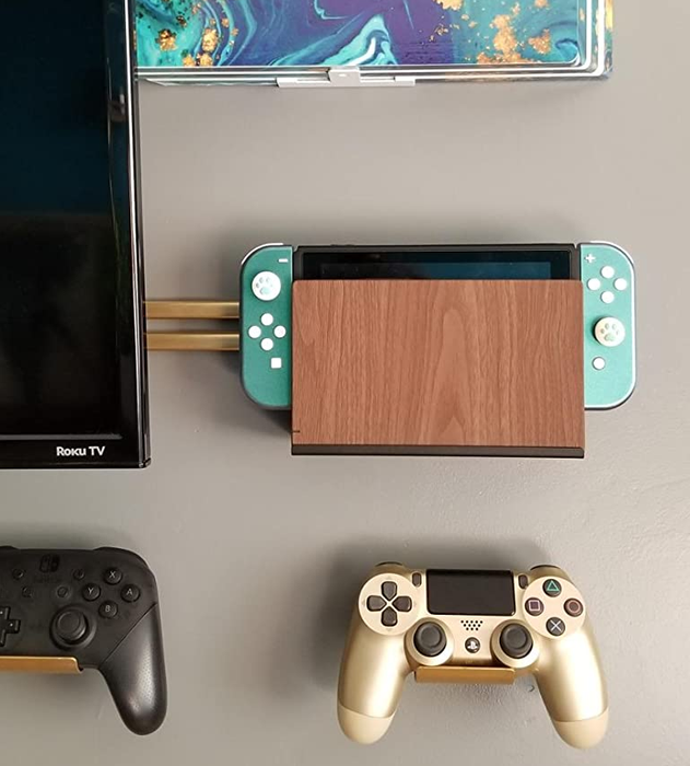 a Switch mounted on a wall beside a TV