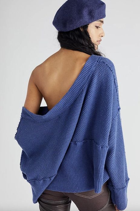 Model wearing a blue sweater