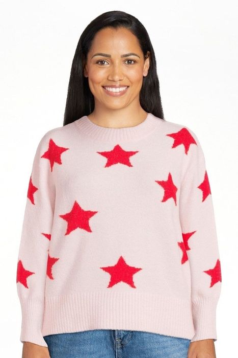 Image of model wearing a pink sweater
