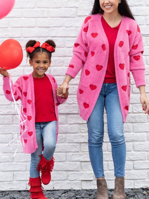 Photo of models wearing pink cardigans