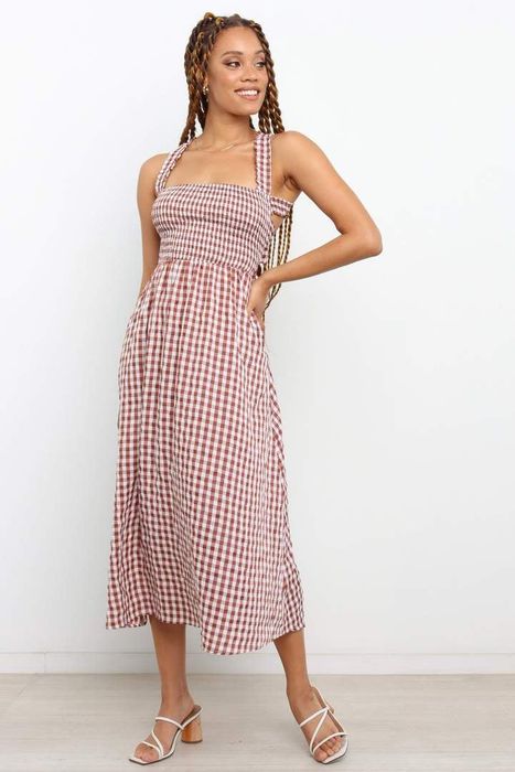 model wearing a halter top with gingham print