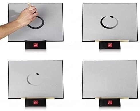 A series of four images demonstrating how the erasable paint works on the gray board