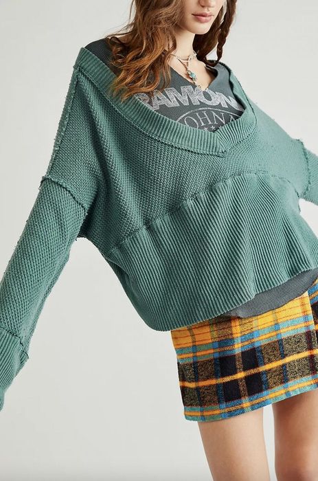 Model wearing a green sweater