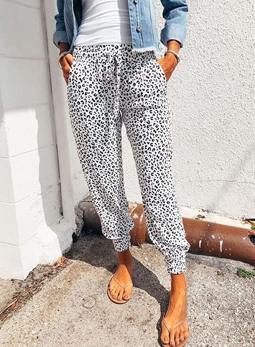 a model wearing the white leopard-print pants