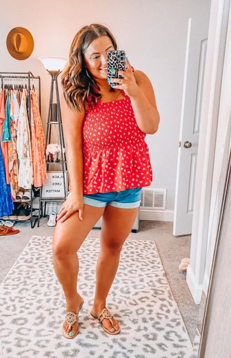 a reviewer wearing the red version of the top