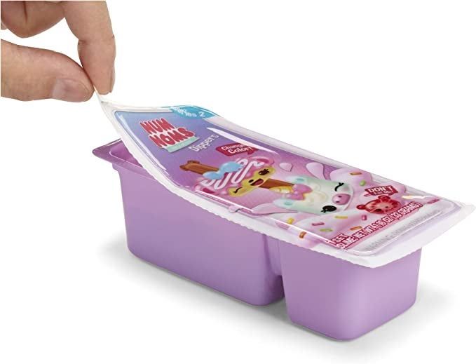 A model peeling back the packaging to reveal the toy inside