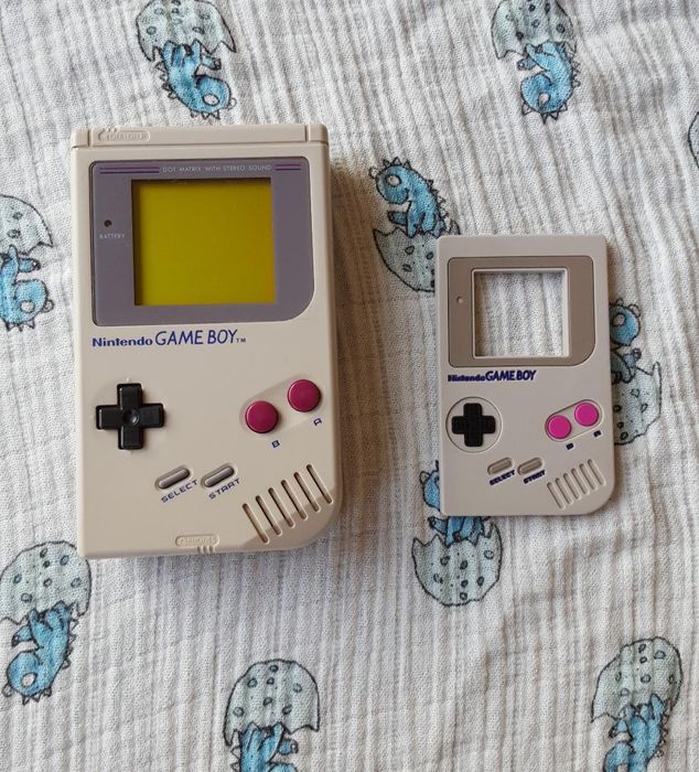 a comparison of a real Game Boy next to the teether