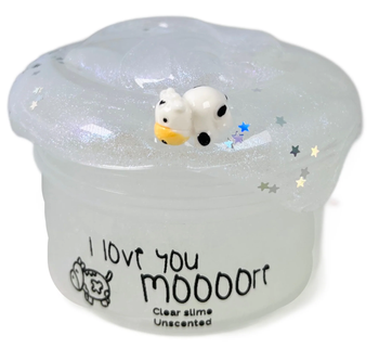 A jar of clear slime filled with glitter, stars, and tiny toy cows