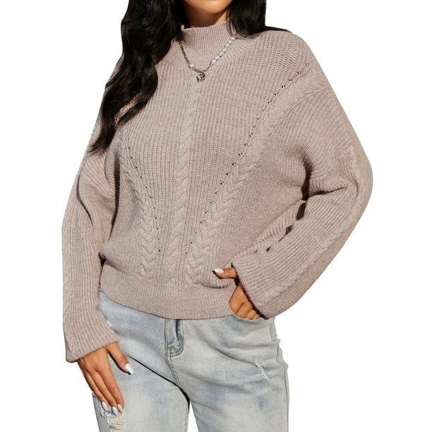 Photo of a model in a beige sweater