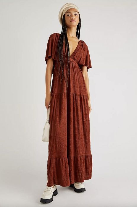 Model wearing a burgundy maxi dress