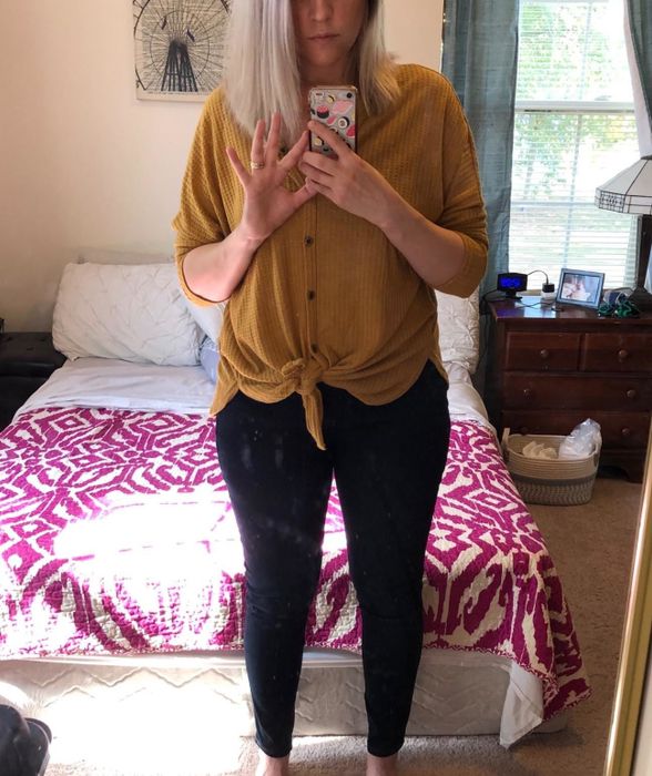 Reviewer showcasing Amazon Essentials skinny jeggings in a dark wash color