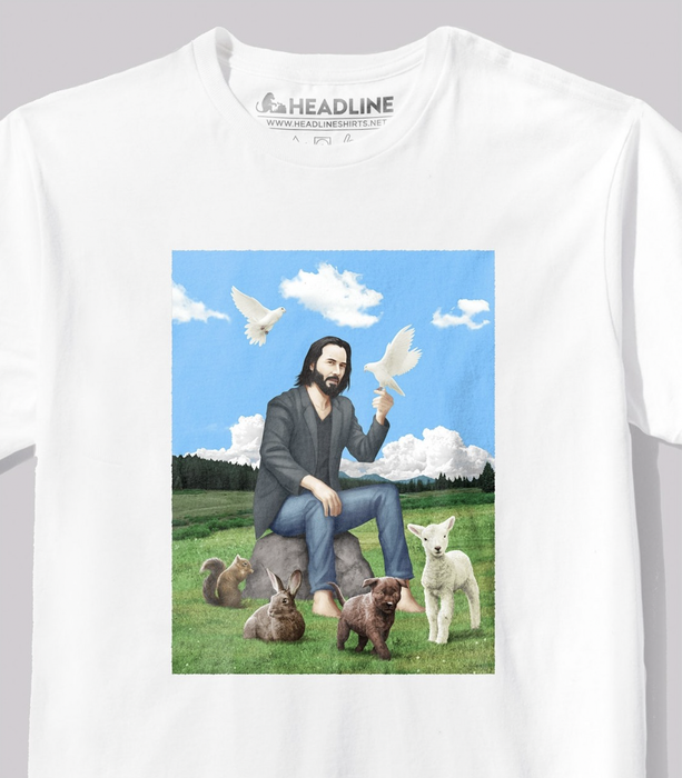 A shirt featuring a graphic of Keanu Reeves depicted as a saint, surrounded by doves and various woodland creatures.