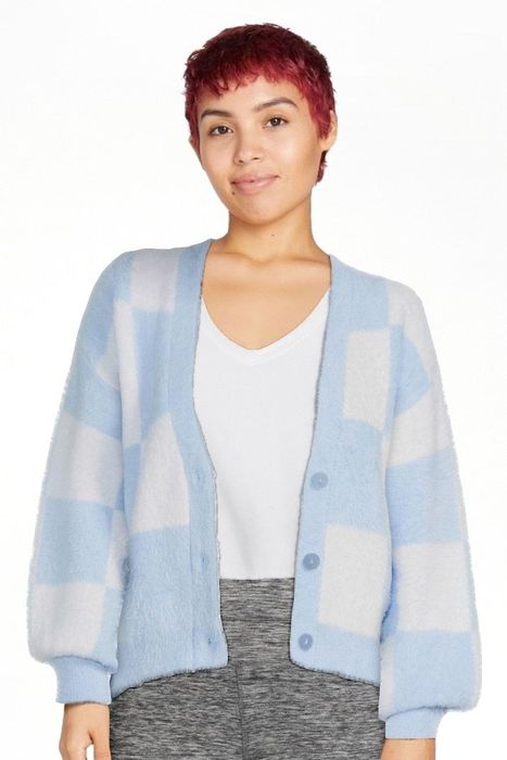 Photo of a model sporting a blue and white cardigan