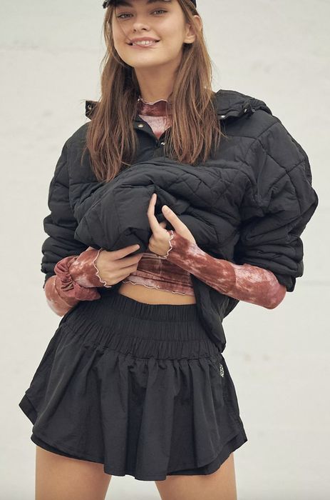 Model wearing a black skort