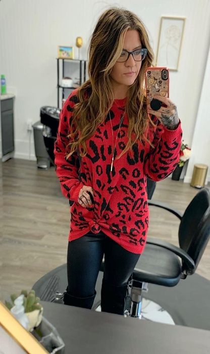 A reviewer in the sweater, but in red.