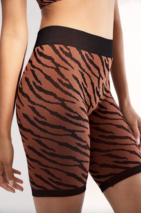 Model wearing tiger-print shorts