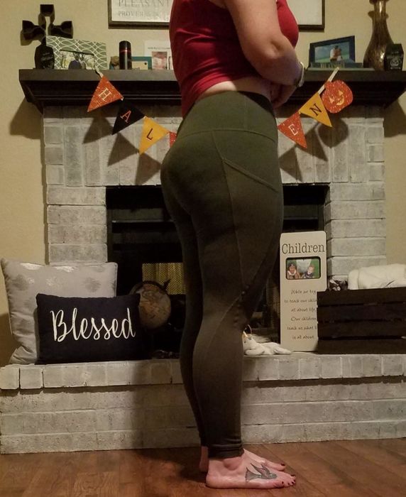 Reviewer wearing leggings in the olive shade
