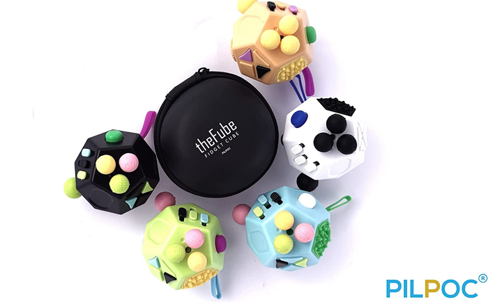 Various color choices for the fidget cube, along with a sleek black carrying case