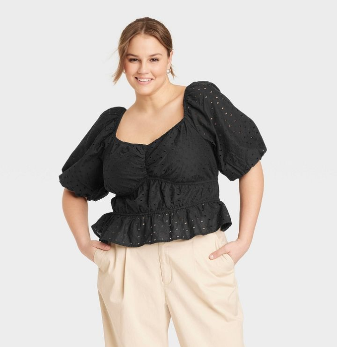 a model sporting the blouse in black