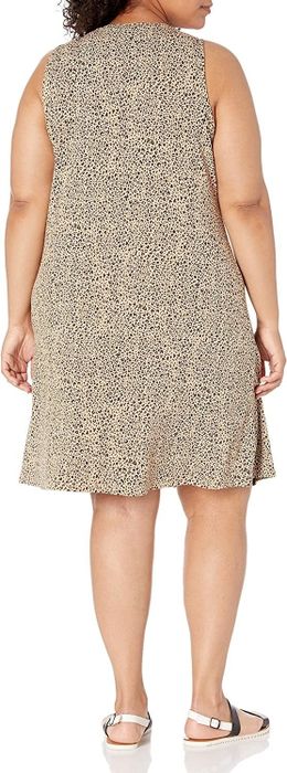 back view of the same model in a leopard print dress