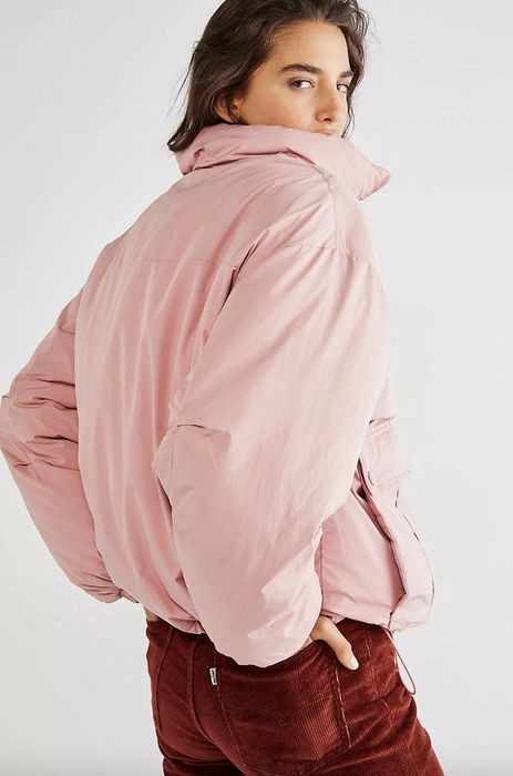 Model wearing a pink duvet jacket