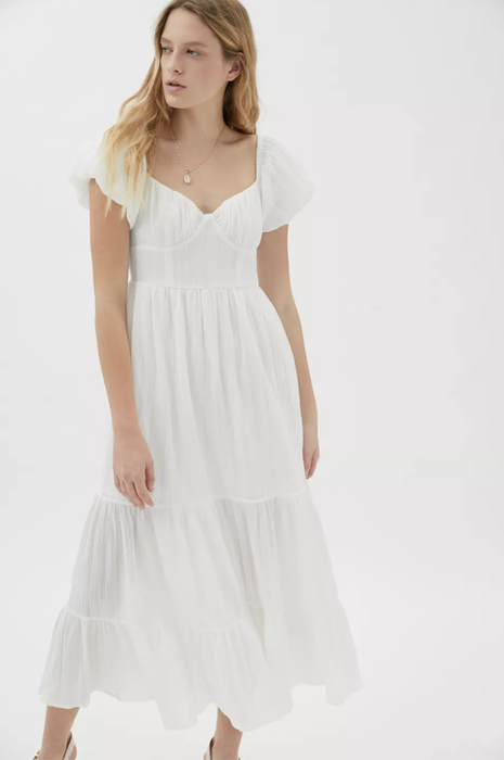 A model wearing a tiered boho-style dress