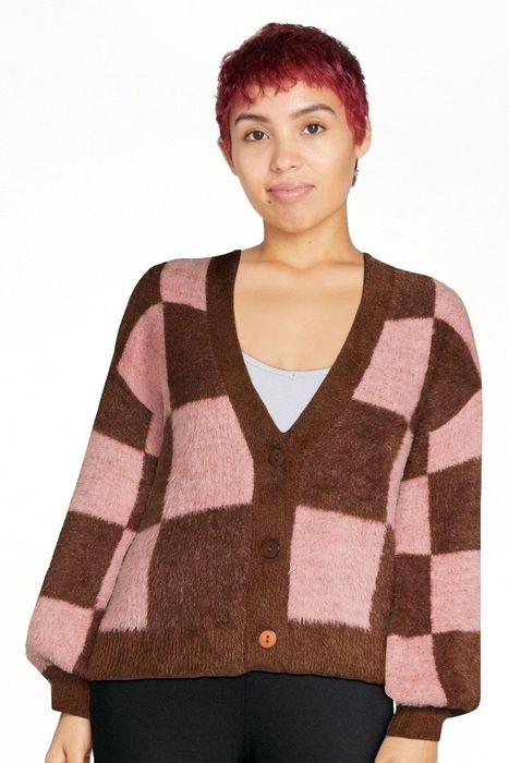 Photo of a model wearing a pink and brown cardigan