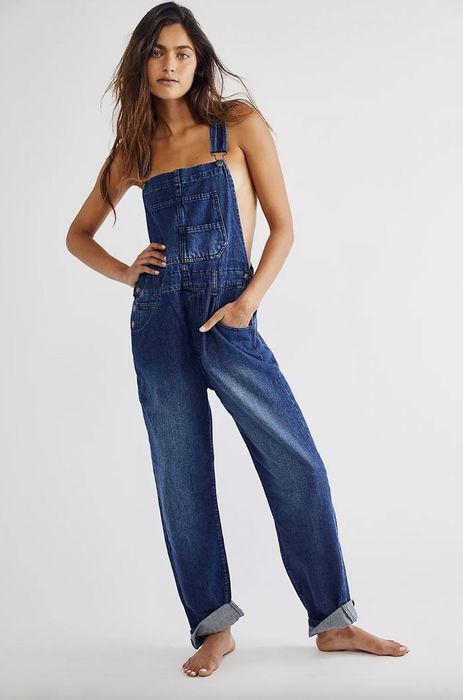 Model wearing blue denim overalls