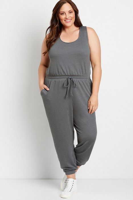 front view of a model wearing the sleeveless gray jumpsuit