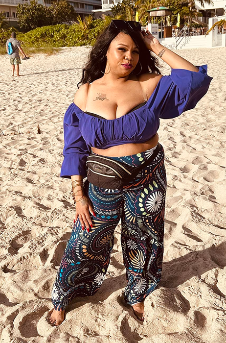 another reviewer styling the pants with a round flower print design