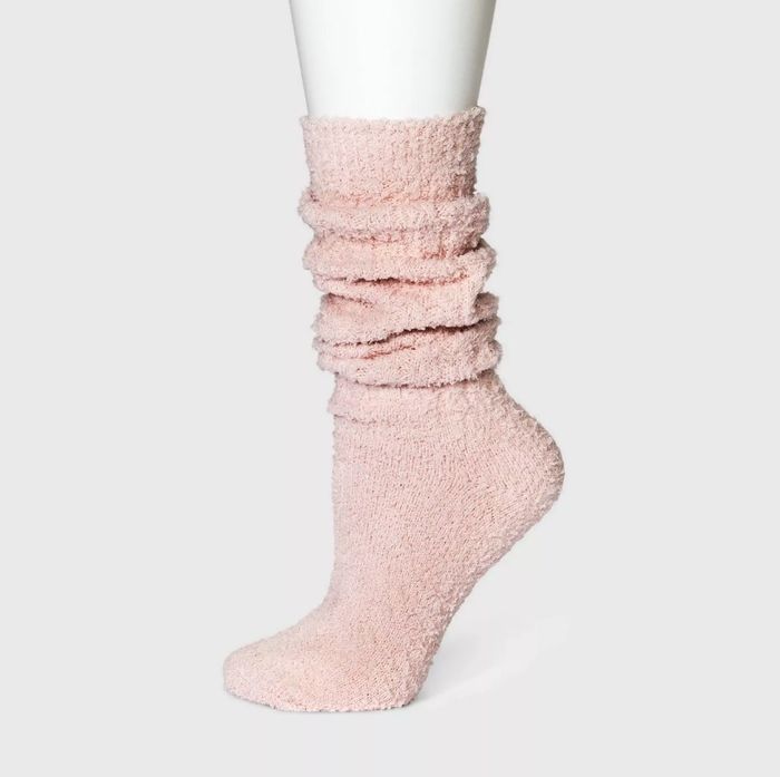 Pink slouchy fuzzy socks, a soft and snug essential for those relaxing moments at home.