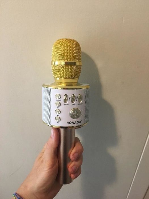 the karaoke microphone in white and yellow