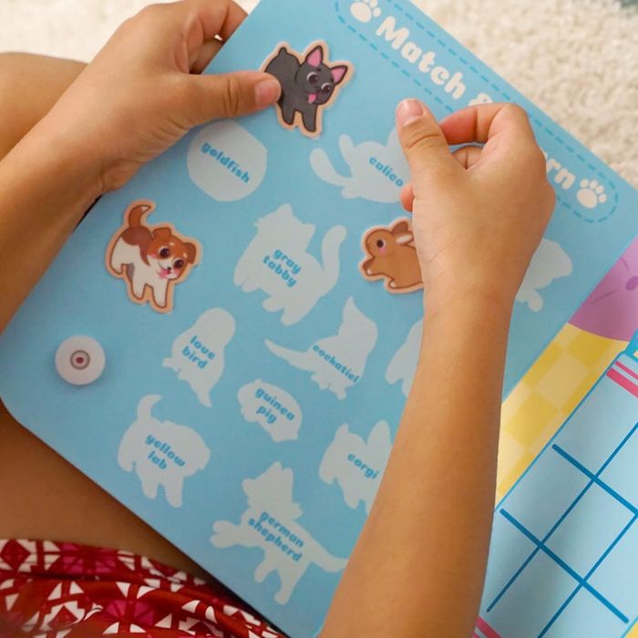 a child matching animals on a fun activity sheet