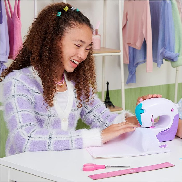 a child operating the sewing machine