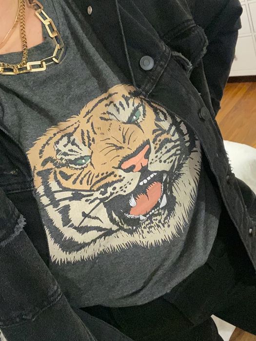 another reviewer wearing the same tiger graphic t-shirt