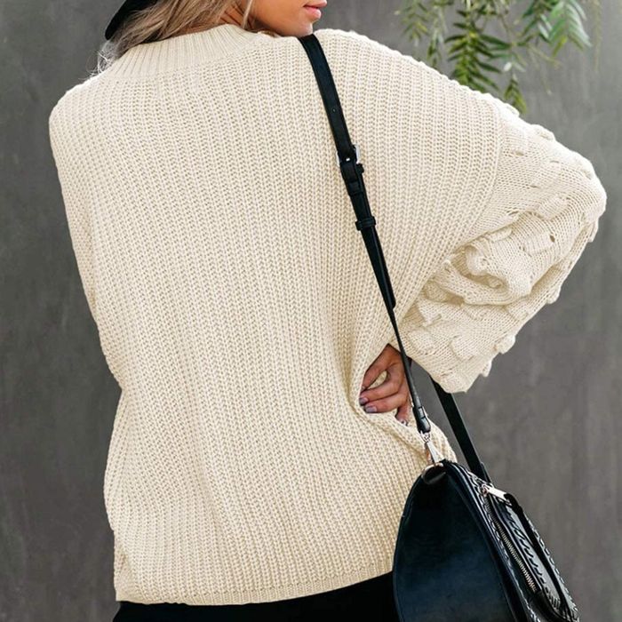 Image of model wearing a white sweater