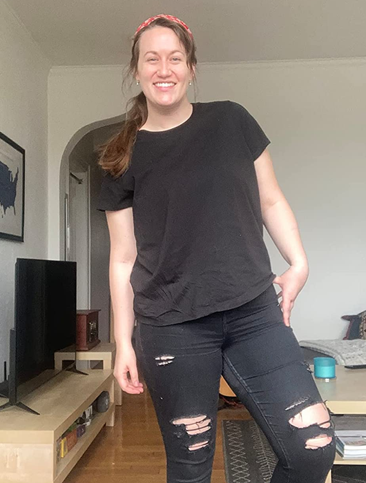 a reviewer showcasing the T-shirt in black