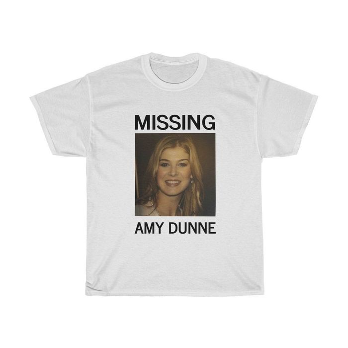 A white tee featuring a striking image of Amy Dunne with the bold phrase