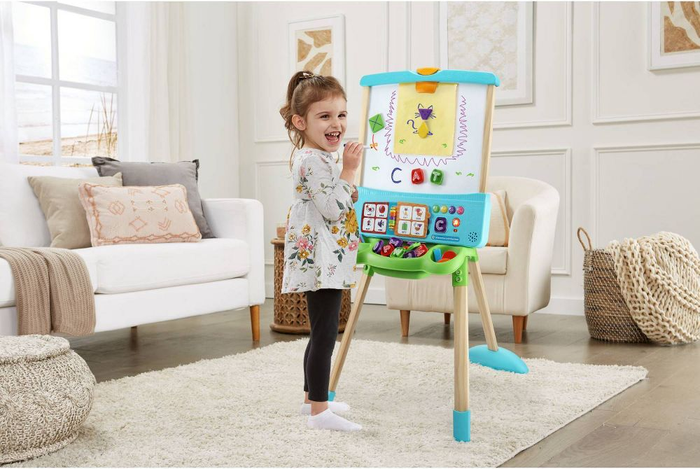 a child playing with the easel