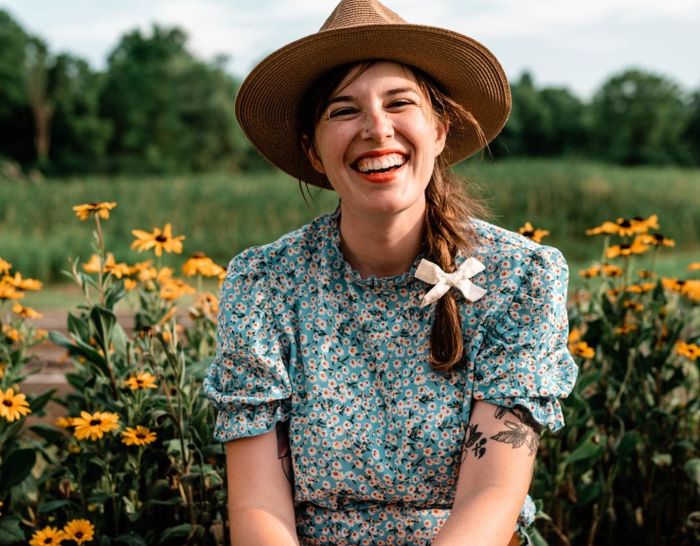 a reviewer wearing the green version of the top